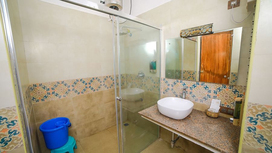 Image of a washroom with a sink and a separate shower area at WOW Bison Woods.